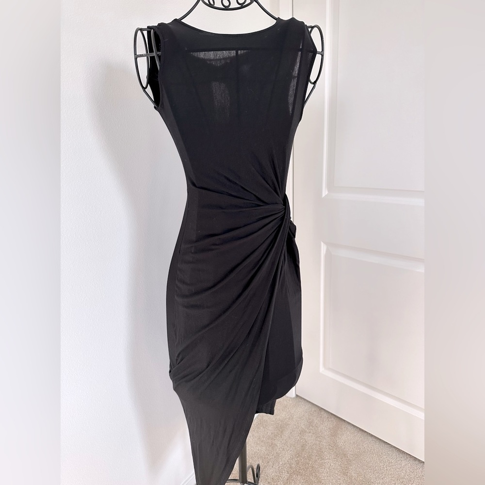 Lush knit black maxi dress with a side knot making one side of the skirt higher
